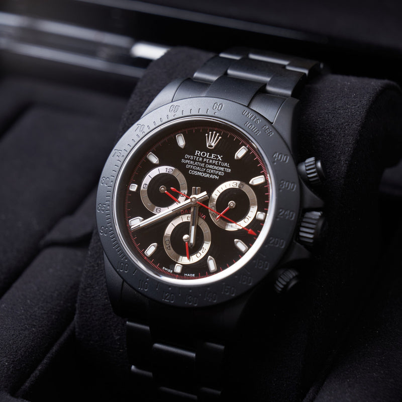 Rolex daytona deals black red dial